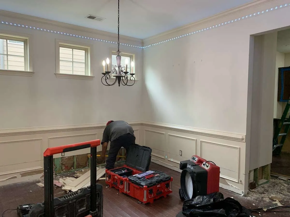 Restoration technician with professional equipment in Whispering Pines